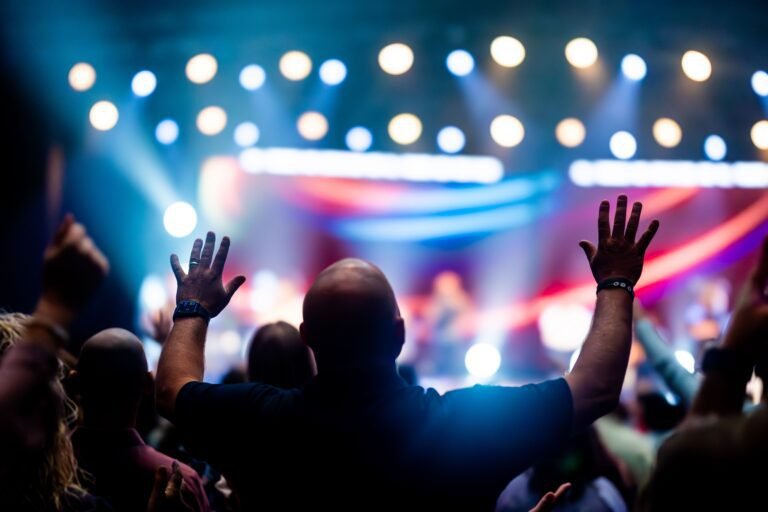 Energetic concert audience with raised hands