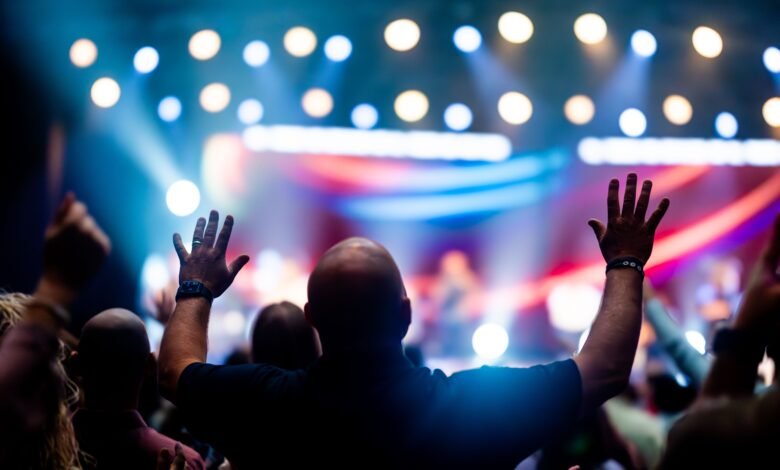 Energetic concert audience with raised hands