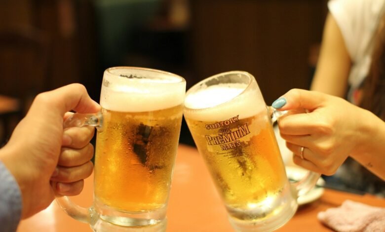 two mugs of brown liquids