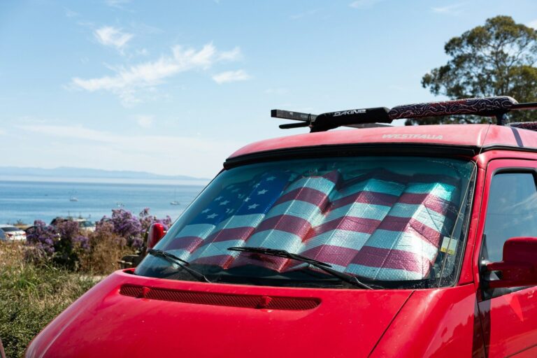 red car with white and black checkered textile on top