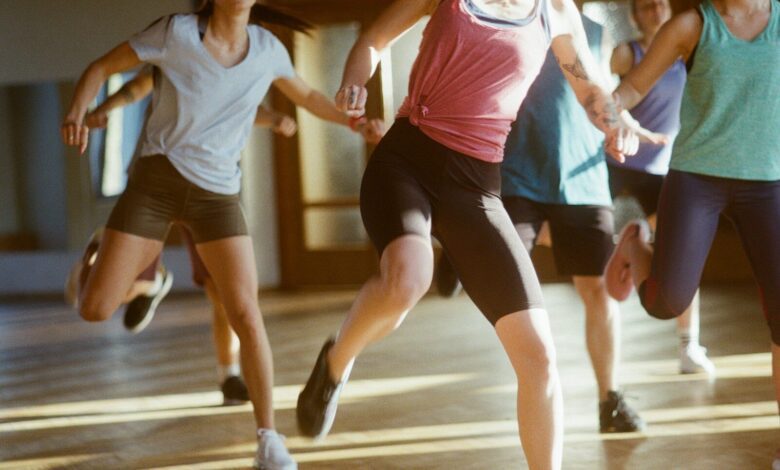 group of women running on brown wooden floor